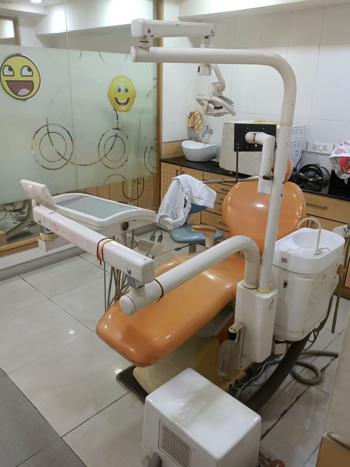 Orange dental chair setup inside Star Orthodontist Clinic