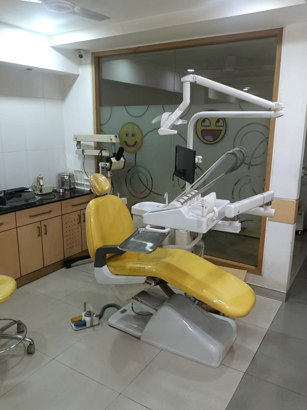 Modern yellow dental chair setup at Star Orthodontist Clinic