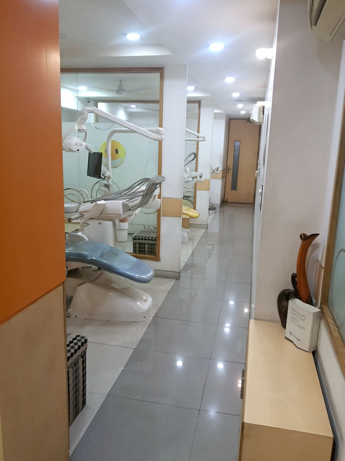 Glass partition corridor and treatment rooms at Star Orthodontist Clinic